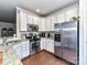 Bright kitchen with white cabinetry, granite countertops, and stainless steel appliances at 2240 Kensington Station Pkwy, Charlotte, NC 28210