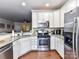 This kitchen features white cabinets, granite countertops, and stainless steel appliances at 2240 Kensington Station Pkwy, Charlotte, NC 28210