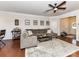 Cozy living room featuring a comfortable sofa, hardwood floors, and stylish decorations at 2240 Kensington Station Pkwy, Charlotte, NC 28210