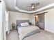 Serene main bedroom featuring a tray ceiling, ceiling fan, and ensuite bath at 2240 Kensington Station Pkwy, Charlotte, NC 28210