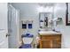 Modern bathroom featuring wood vanity, shower with clear door, and toilet at 2243 Flint Glenn Ln, Charlotte, NC 28262