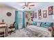 Cozy bedroom features a ceiling fan, neutral walls, and comfortable daybed with lots of pillows at 2243 Flint Glenn Ln, Charlotte, NC 28262