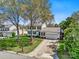 Charming two-story home with mature trees, a well-manicured lawn and a two-car garage at 2243 Flint Glenn Ln, Charlotte, NC 28262