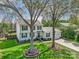 Traditional two-story home with white siding, green shutters, and a beautiful front lawn at 2243 Flint Glenn Ln, Charlotte, NC 28262