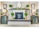 Stylish fireplace mantel with decorative accents and white brick backdrop at 2243 Flint Glenn Ln, Charlotte, NC 28262