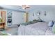 Airy primary bedroom with modern accents, ceiling fan, and access to a walk-in closet at 2243 Flint Glenn Ln, Charlotte, NC 28262