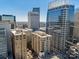 Impressive aerial perspective highlighting a cluster of towering buildings that define the city skyline, a modern urban landscape at 230 S Tryon St # 610, Charlotte, NC 28202