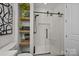Modern bathroom with a glass-enclosed shower and built-in shelving at 230 S Tryon St # 610, Charlotte, NC 28202