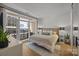 Cozy bedroom with a private balcony offering city views at 230 S Tryon St # 610, Charlotte, NC 28202