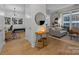 Inviting foyer with hardwood floors, decorative lighting, and an open view to the living room at 230 S Tryon St # 610, Charlotte, NC 28202