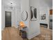 Entrance featuring hardwood floors, neutral walls, and modern decor leading to the living spaces at 230 S Tryon St # 610, Charlotte, NC 28202