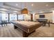 Game room features a pool table, chairs, and tables under recessed lights at 230 S Tryon St # 610, Charlotte, NC 28202