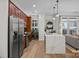 Modern kitchen featuring an island with stone countertops and stainless steel appliances at 230 S Tryon St # 610, Charlotte, NC 28202