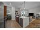 Modern kitchen with a large island, stainless steel appliances, and an open concept living area at 230 S Tryon St # 610, Charlotte, NC 28202
