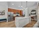 Modern kitchen featuring stainless steel appliances, a large island, and hardwood floors at 230 S Tryon St # 610, Charlotte, NC 28202