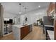 Bright, open kitchen featuring an island with a quartz countertop and stainless steel appliances at 230 S Tryon St # 610, Charlotte, NC 28202