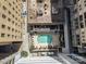 Overhead view showcases a rooftop pool and lounge area, surrounded by buildings, offering relaxation and city views at 230 S Tryon St # 610, Charlotte, NC 28202