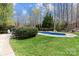 Spacious backyard with a large in-ground pool, and green lawn at 270 Almora Loop, Mooresville, NC 28115