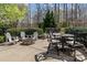 Inviting backyard firepit and outdoor seating area with mature landscaping at 270 Almora Loop, Mooresville, NC 28115