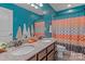 This bathroom showcases a double vanity with granite countertop and a colorful shower curtain at 270 Almora Loop, Mooresville, NC 28115
