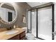 Bathroom with vanity, granite countertop, and a shower with glass doors at 270 Almora Loop, Mooresville, NC 28115