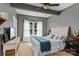 Comfortable bedroom with a gray wall, and a large window that allows natural light at 270 Almora Loop, Mooresville, NC 28115
