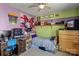 Fun bedroom featuring colorful walls, fan, and decorative artwork at 270 Almora Loop, Mooresville, NC 28115