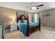 Traditional bedroom showcases a dark wood poster bed with blue bedding, complemented by matching lamps and nightstands at 270 Almora Loop, Mooresville, NC 28115