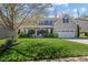 Lovely two-story home boasts a welcoming front porch and well-kept landscaping at 270 Almora Loop, Mooresville, NC 28115