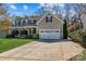 Charming two-story home features a two-car garage and a well-manicured lawn at 270 Almora Loop, Mooresville, NC 28115