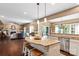 Modern kitchen island with granite countertops overlooking the living room at 270 Almora Loop, Mooresville, NC 28115