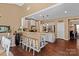 Open kitchen with breakfast bar, granite countertops, and stainless steel appliances at 270 Almora Loop, Mooresville, NC 28115