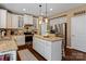 Spacious kitchen island with granite countertops and stainless steel refrigerator at 270 Almora Loop, Mooresville, NC 28115