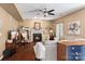 Cozy living room with a fireplace, comfortable seating, and hardwood floors at 270 Almora Loop, Mooresville, NC 28115