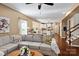 Open concept living room with hardwood floors leading to the kitchen and stairs at 270 Almora Loop, Mooresville, NC 28115