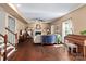 Inviting living room with a fireplace and a piano with stairs in the background at 270 Almora Loop, Mooresville, NC 28115