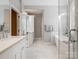 Stunning bathroom featuring double vanities, a soaking tub, and a separate glass-enclosed shower at 3600 Castellaine Dr, Charlotte, NC 28226