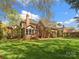 Beautiful brick home with lush landscaping, a screened-in porch, and a spacious backyard at 3600 Castellaine Dr, Charlotte, NC 28226