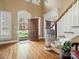 Grand foyer with hardwood floors, high ceilings, and staircase at 3600 Castellaine Dr, Charlotte, NC 28226