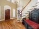 Elegant foyer with hardwood floors and an ornate decorative seat at 3600 Castellaine Dr, Charlotte, NC 28226