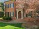 Inviting front entrance with brick steps and manicured landscaping at 3600 Castellaine Dr, Charlotte, NC 28226