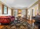 Comfortable living room featuring a decorative rug and classic decor at 3600 Castellaine Dr, Charlotte, NC 28226