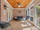 Covered patio featuring a ceiling fan, tile flooring, and outdoor seating with seating at 3600 Castellaine Dr, Charlotte, NC 28226