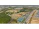Aerial view of community baseball and tennis park with fields and wooded area at 3918 Dahlia Dr # 15, Harrisburg, NC 28075