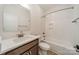 Modern bathroom features a tiled shower, bathtub, single vanity, and a neutral color palette at 3918 Dahlia Dr # 15, Harrisburg, NC 28075