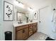 Modern bathroom with double sinks, decorative floor tiles, and stylish fixtures at 3918 Dahlia Dr # 15, Harrisburg, NC 28075