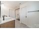 Bathroom with double vanity, subway tile in shower, decorative tile floor and matte black hardware at 3918 Dahlia Dr # 15, Harrisburg, NC 28075
