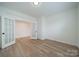 This spacious room is perfect for a bedroom, complete with hardwood floors and neutral walls at 3918 Dahlia Dr # 15, Harrisburg, NC 28075