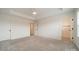 Spacious bedroom featuring neutral carpeting, ceiling fan, and two doorways at 3918 Dahlia Dr # 15, Harrisburg, NC 28075