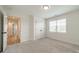 Bright bedroom with carpet, double closets, and a window at 3918 Dahlia Dr # 15, Harrisburg, NC 28075